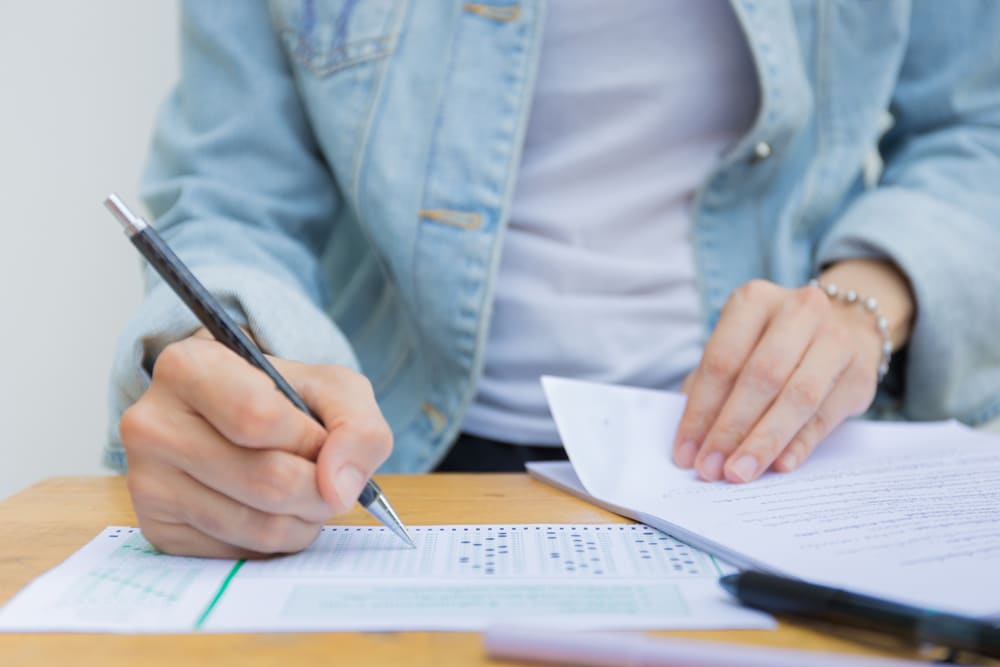 Student taking a pen and paper exam