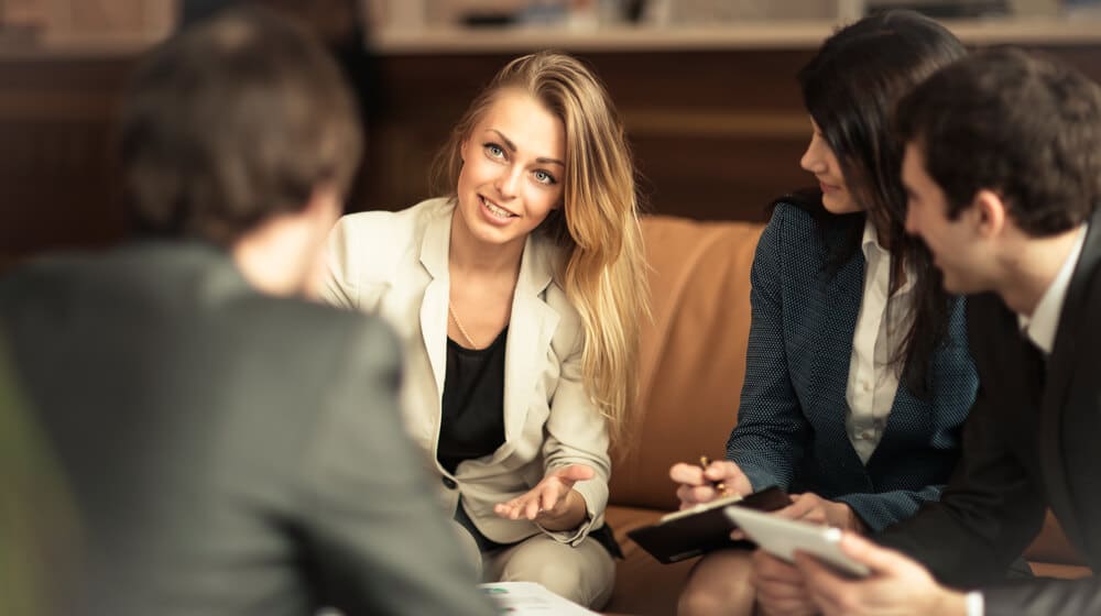 A group of successful business colleagues discussing