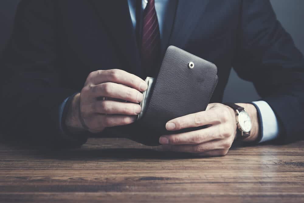 Businessman taking out money from his wallet