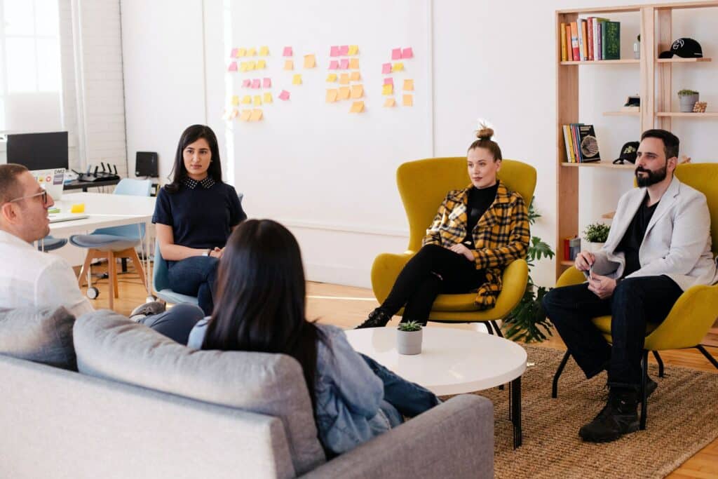 Group of colleagues discussing in the office