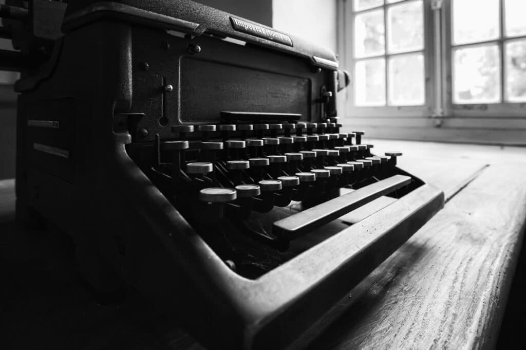 Old typewriter on a wooden desk